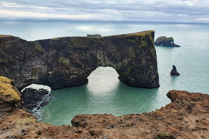 Private South Coast Tour: A Journey to Iceland’s Stunning Shore - Sólheimajökull glacier edge: blue ice and black ash streaks