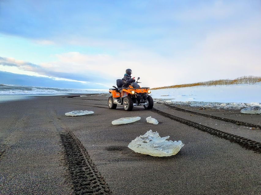 Reykjavík: Black Sand Beach 2-Hour ATV Adventure - Riding Black Sand Beach: cliffs, surf, and volcanic detail